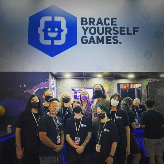 A photo of the Novy Unlimited team at PAX West in the Brace Yourself Games booth.